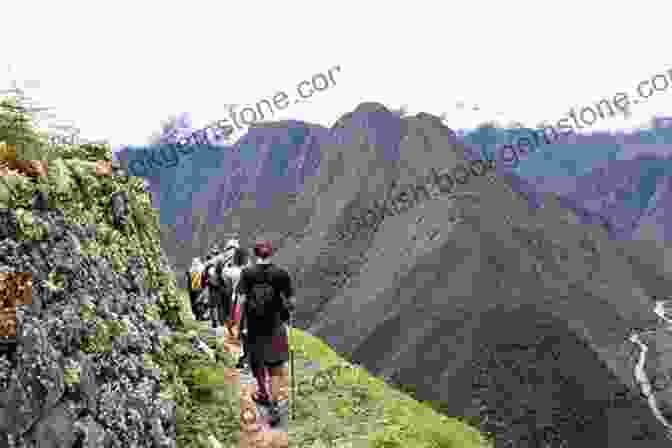 A Photo Of The Inca Trail, A Winding Path Through The Andes Mountains, With Machu Picchu In The Distance THE INCA TRAIL TO MACHU PICCHU: The Sacred Route