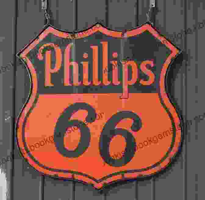 A Restored Phillips 66 Sign, Featuring The Iconic Shield And Vibrant Red And Blue Colors. The Zeon Files: Art And Design Of Historic Route 66 Signs